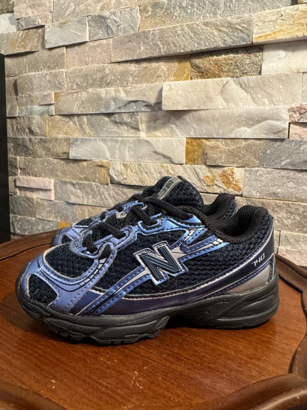 New Balance 740 kids' Sz 10 sneakers in a blue, black, and silver